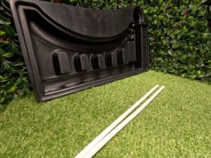 Regal Arch Mold with the two included pipes used to form the rebar holes in each fence panel.