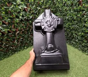 Fireman Cross concrete mold shown by hand for size reference