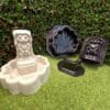 Unpainted Peewee Frog Fountain displayed beside the complete three-piece frog fountain mold set