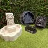 Unpainted Peewee Frog Fountain displayed beside the complete three-piece frog fountain mold set