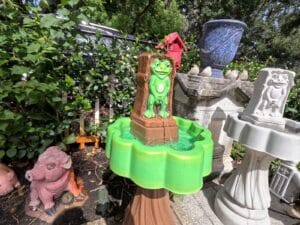 Finished Peewee Frog Fountain made from the frog fountain mold set, painted green and brown and displayed outdoors.